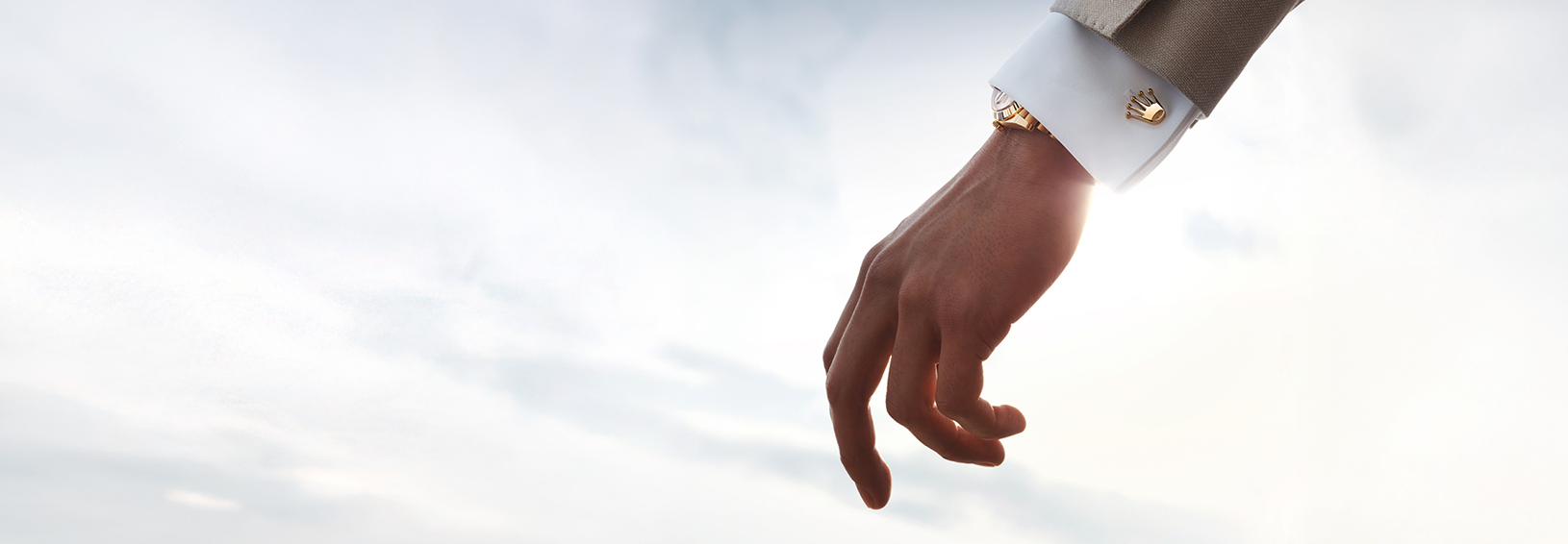 A person wearing Rolex accessories