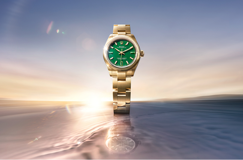 Rolex Oyster Perpetual in yellow gold with a green dial